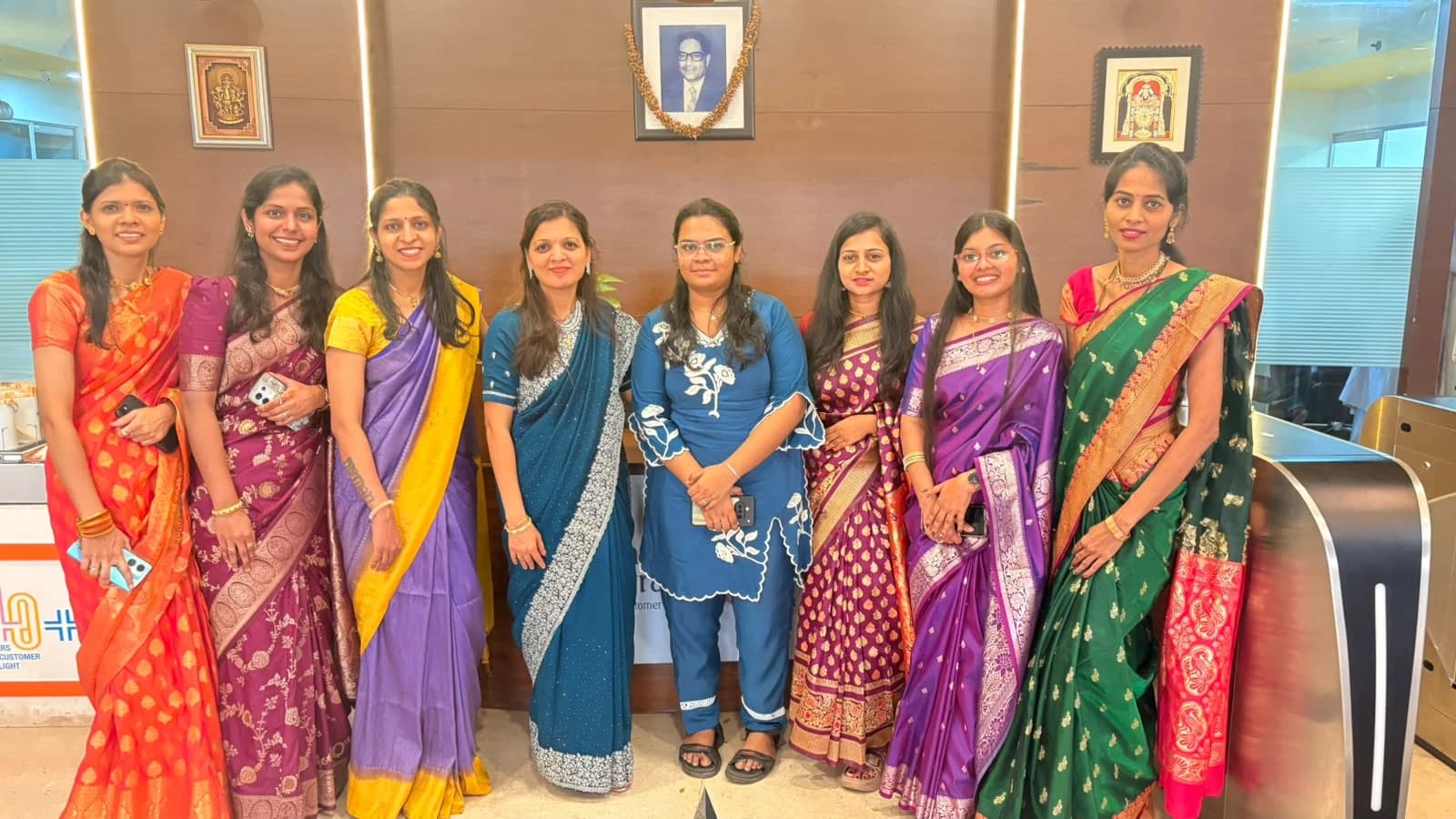 Babaji Shivram colleagues together at the office in colourful traditional clothing